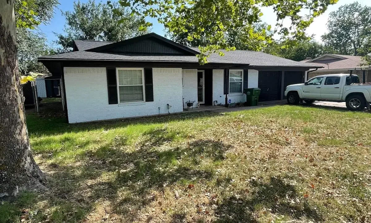 Professional roofing crew working on a residential roof in Dunedin